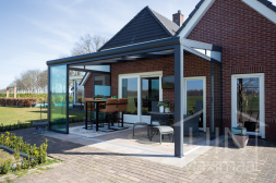 Aluminium conservatory with glass sliding door and glass wedge