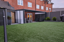 Anthracite veranda with glass sliding doors and polycarbonate sidewalls
