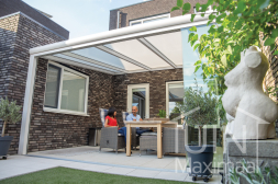 Matt white modern aluminium veranda with polycarbonate roof and glass sliding doors
