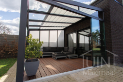 Patio cover with polycarbonate sidewall and sliding doors